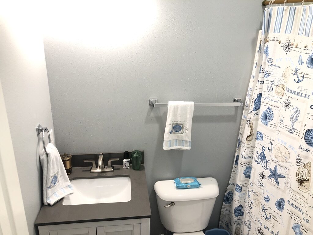 Compact bath with a stone vanity top