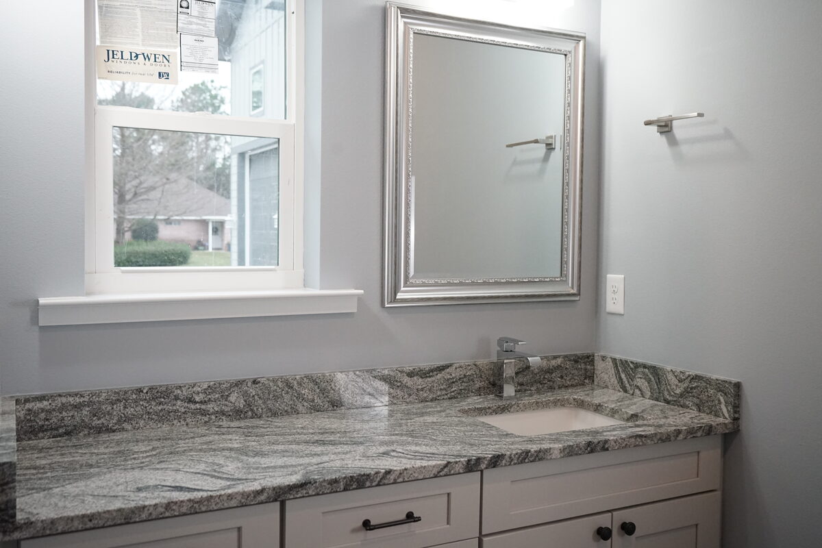 Double vanity in speckled granite
