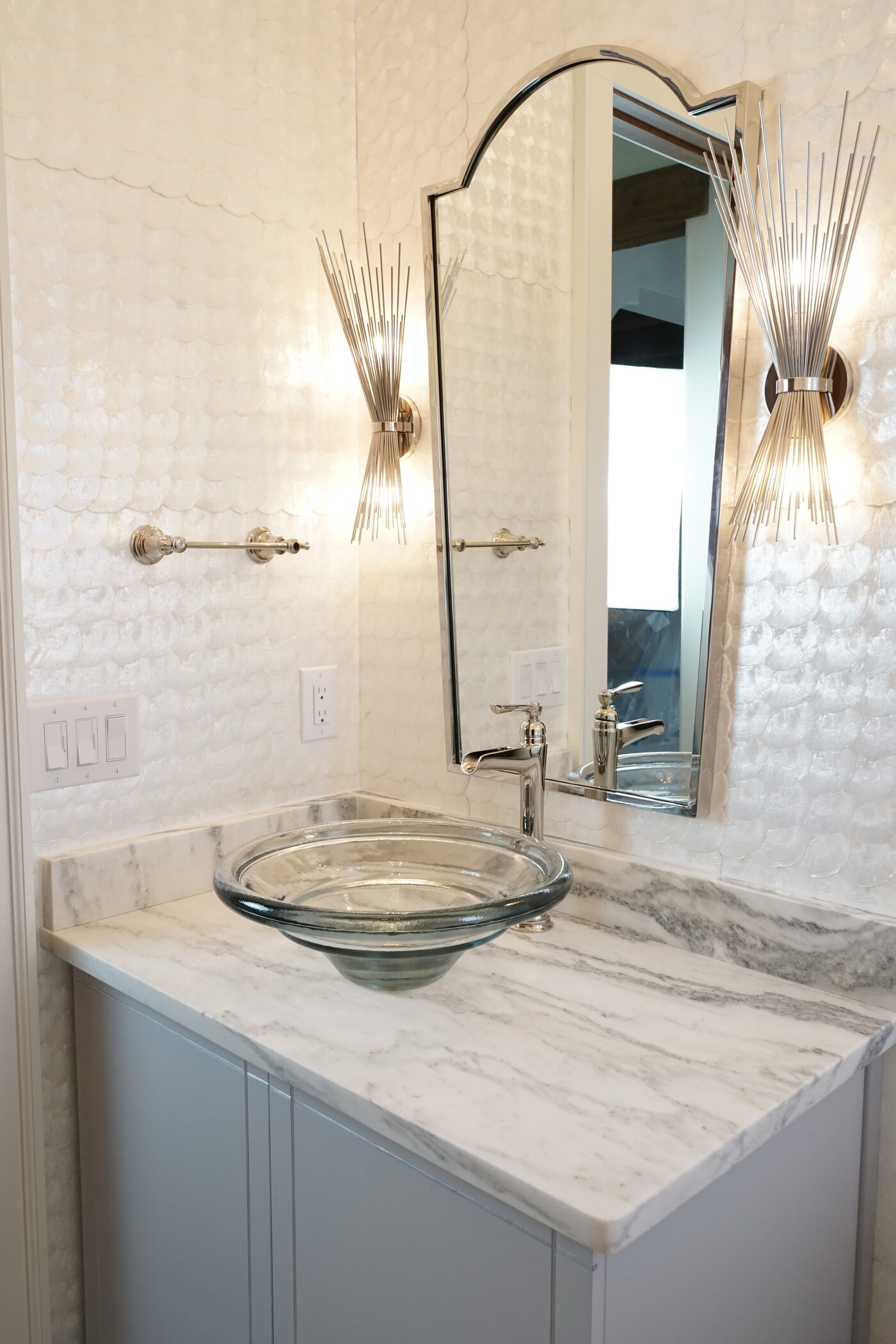 Glass vessel sink on a quartzite top