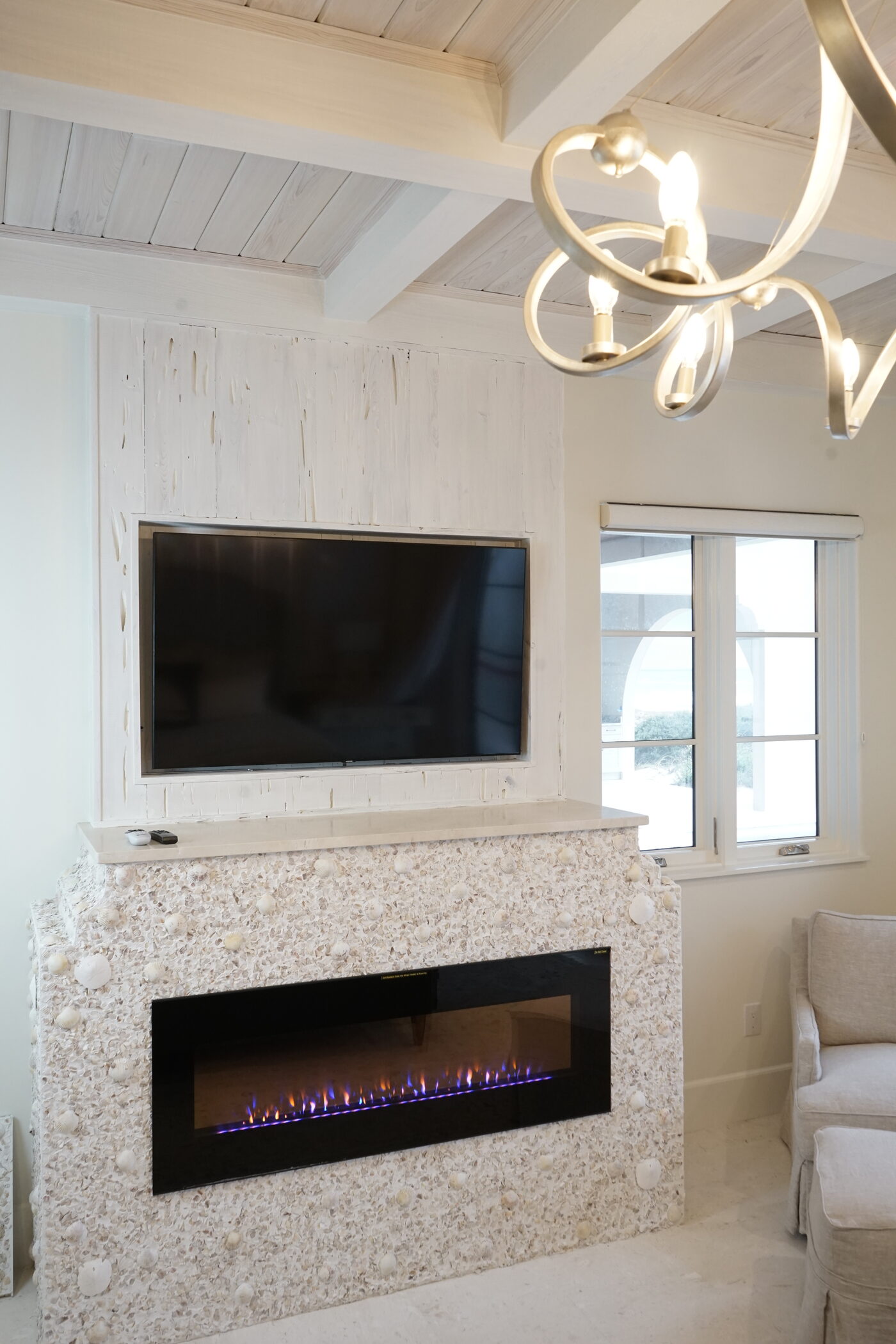 Shell stone surround around a linear fire