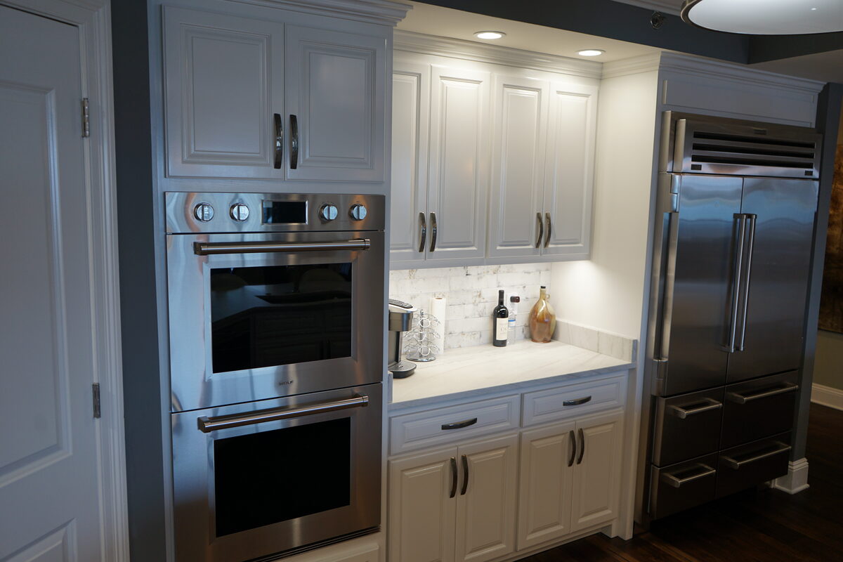White kitchen with double wall ovens