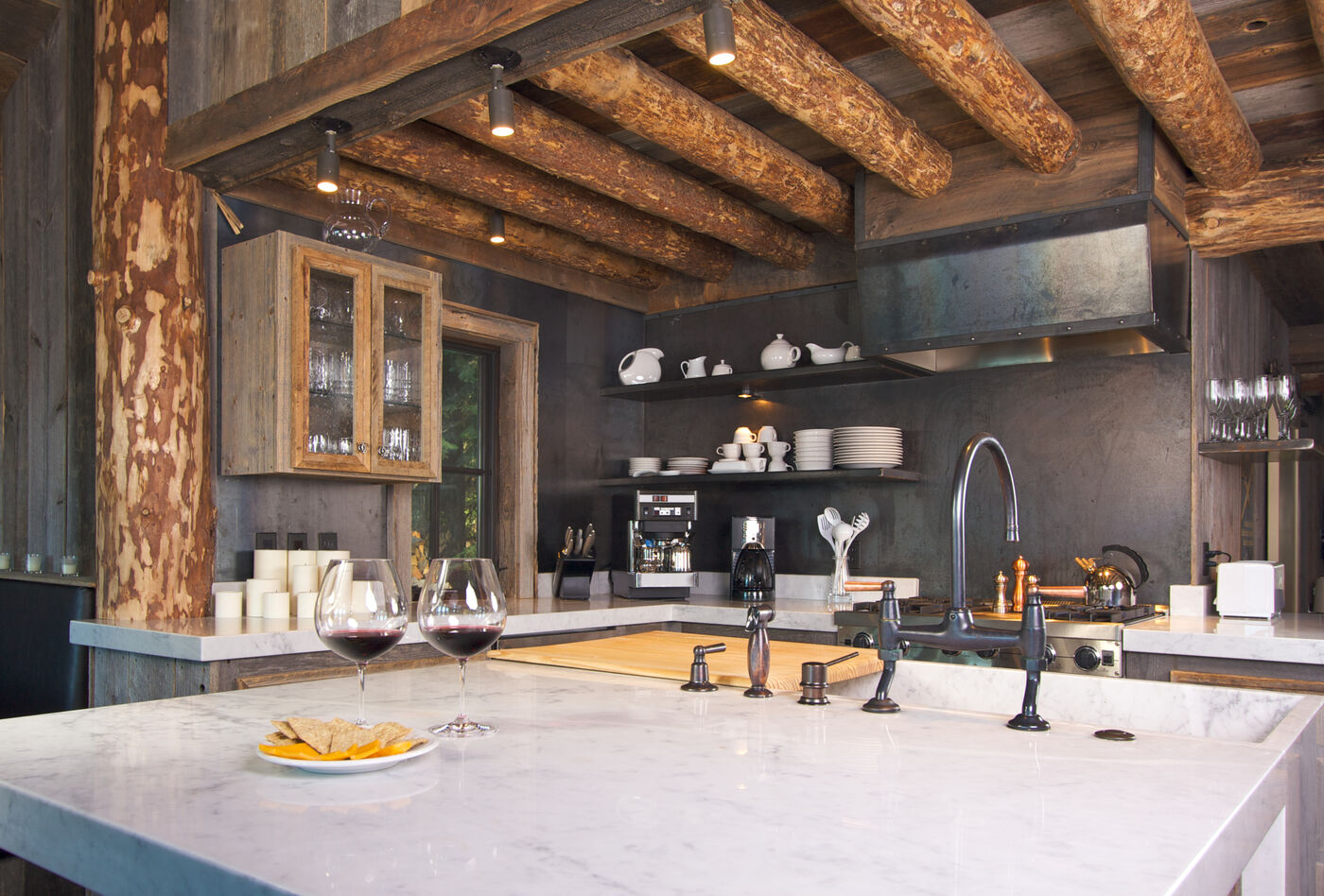 Log cabin kitchen with a marble island