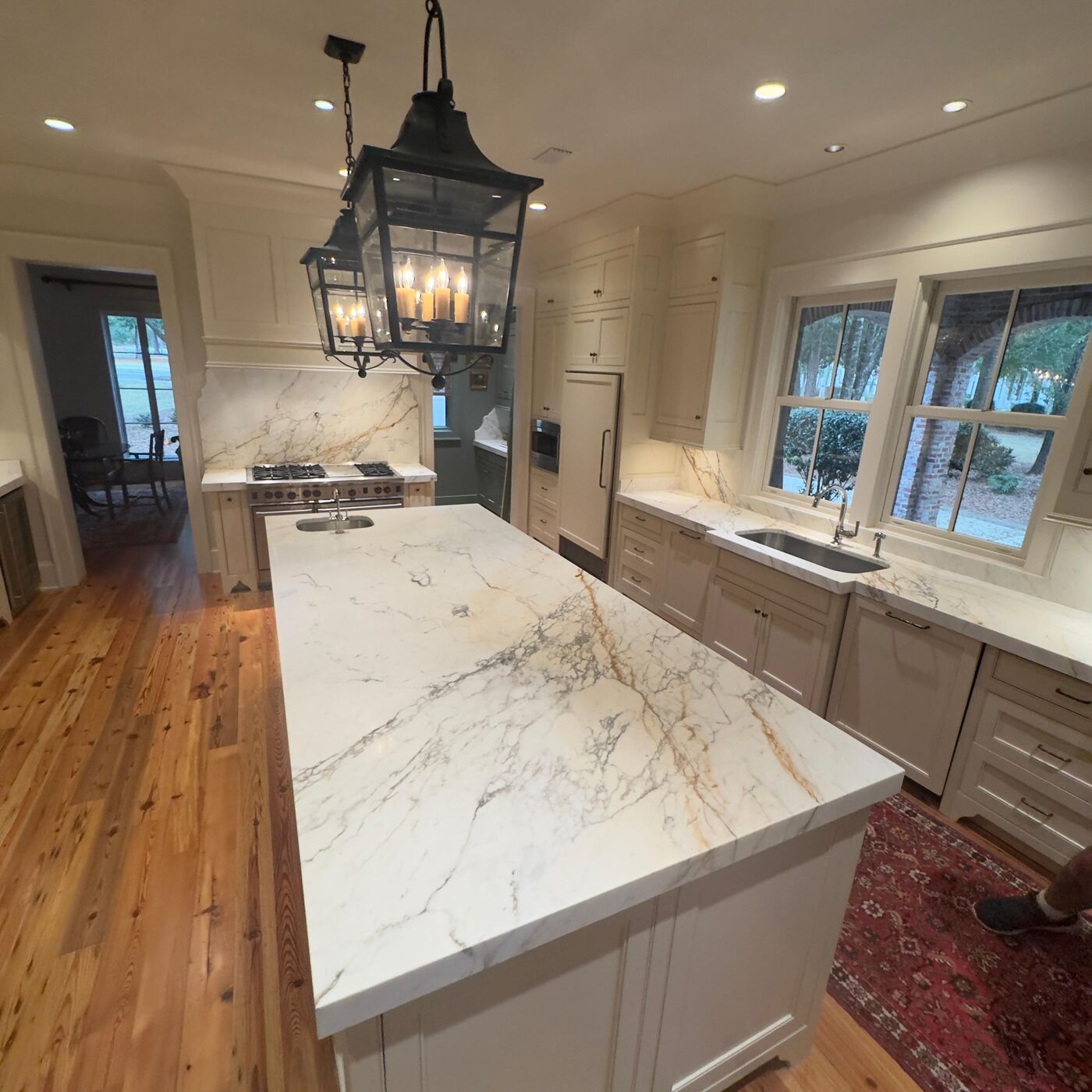 Marble counter run under lantern pendants