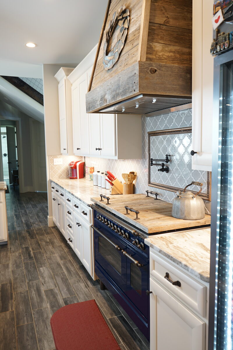 Wood hood kitchen with a blue range