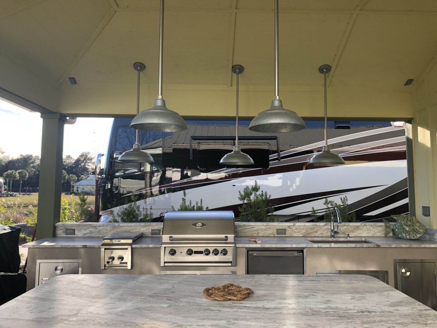 Built in grill run under a covered pavilion