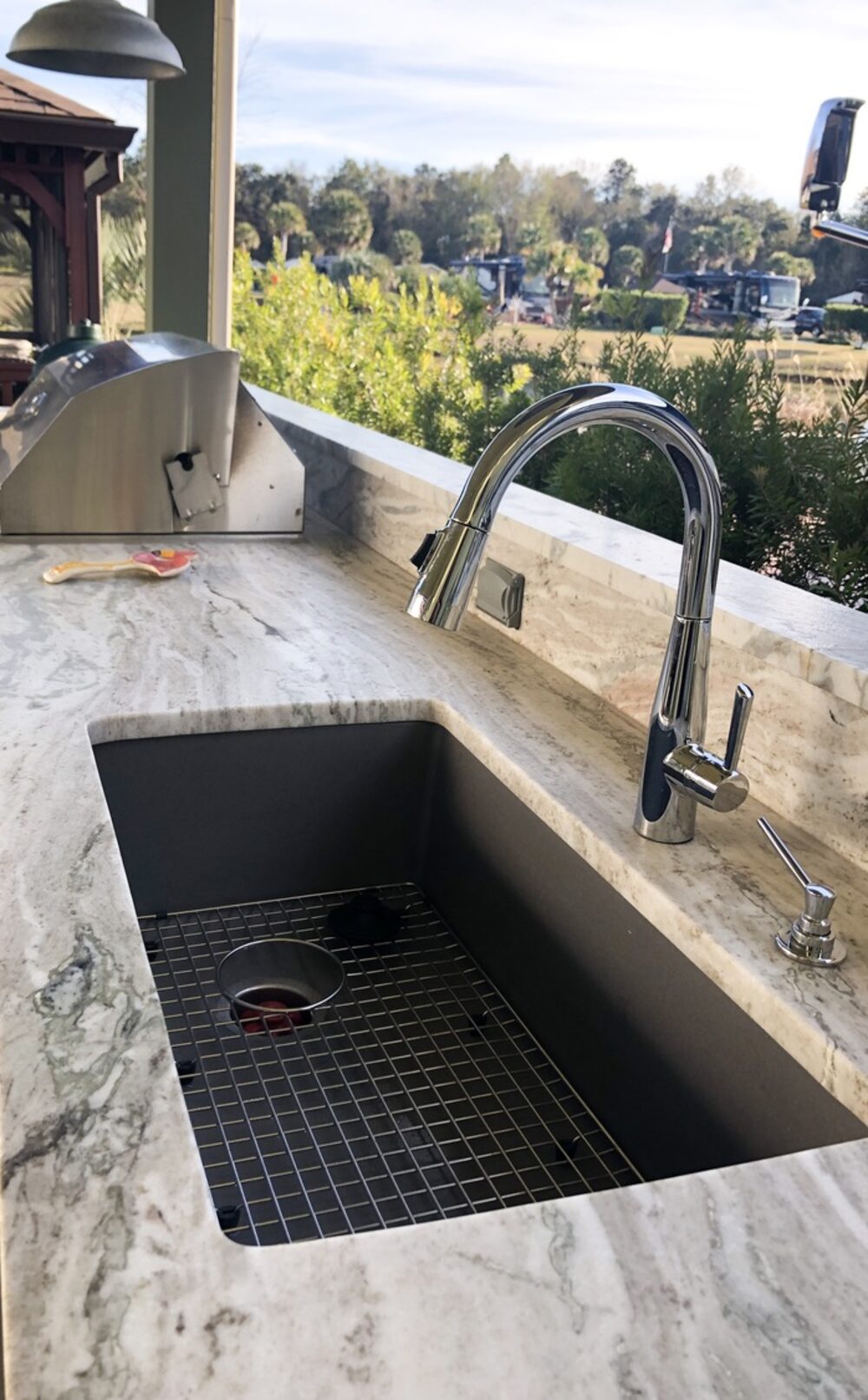 Prep sink cut into the stone, looking out over the water