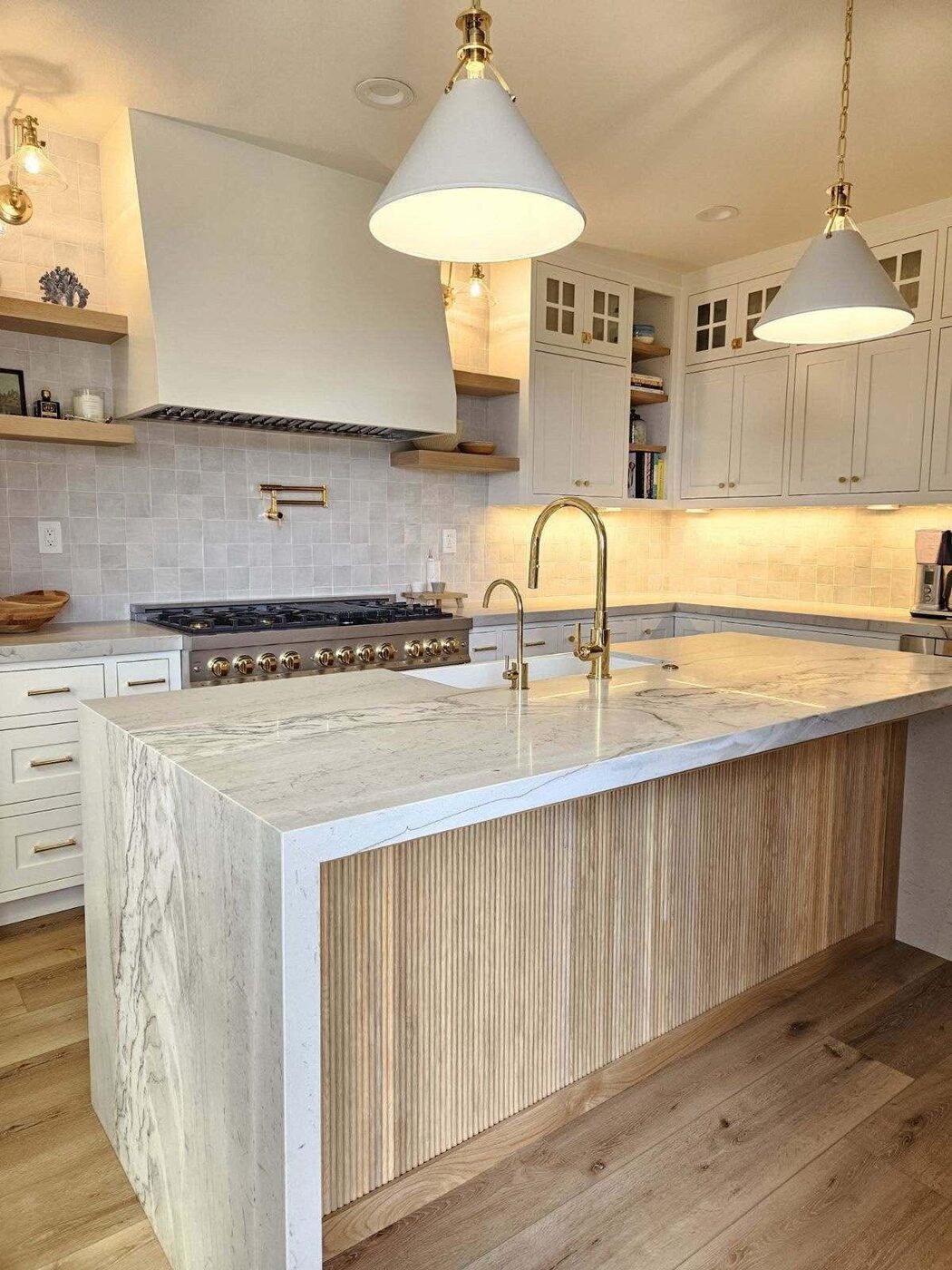 White quartzite island, wood cabinetry