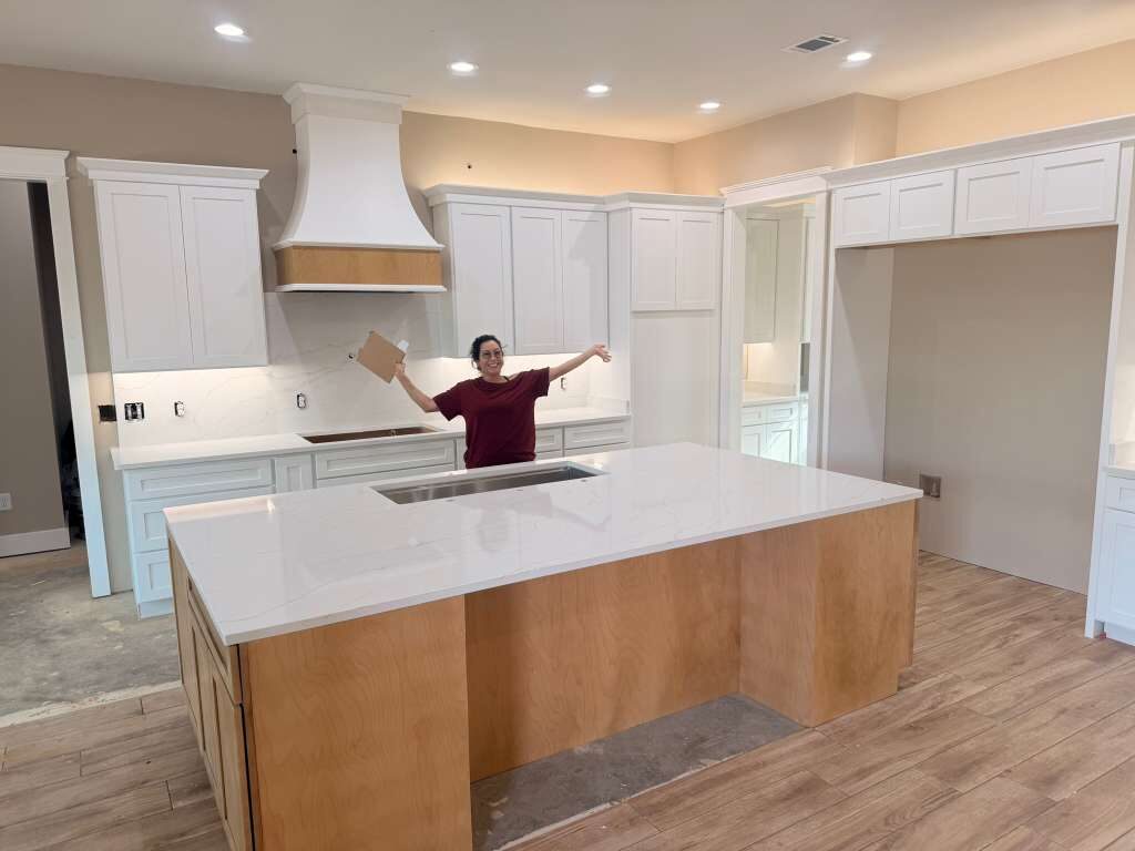 Wood island in a white kitchen
